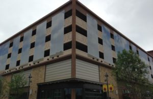 Parking garage with facade on side.