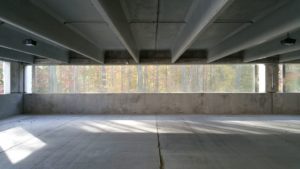 Interior of Crocker Park parking garage with view of reverse side of textile facade cladding.