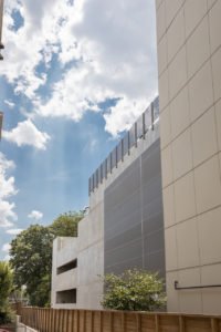 Parking garage with mesh tensile facade.