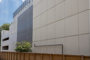 Parking garage with mesh tensile facade.
